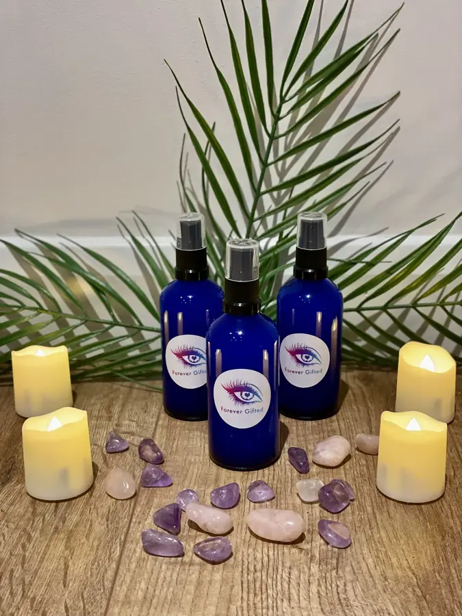 Her Reiki-infused cleansing sprays among candles and tumbled crystals