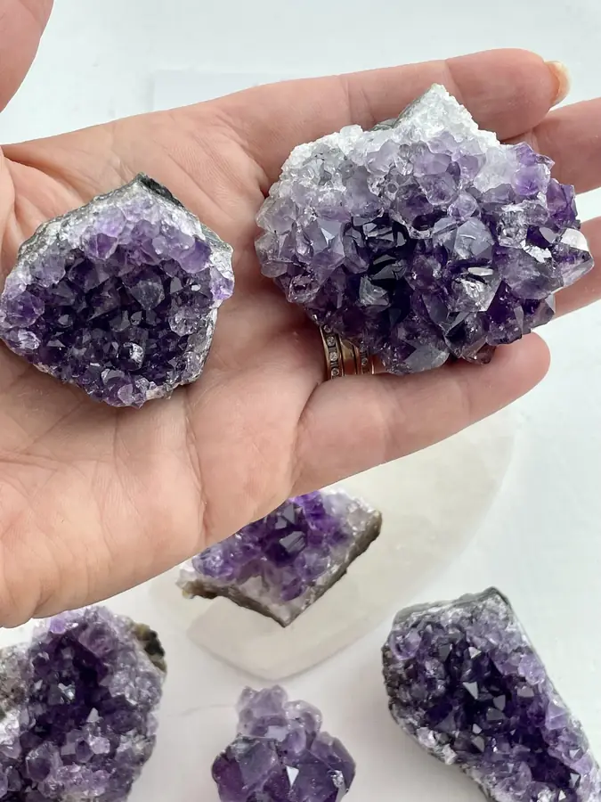 Amethyst druze cluster, held in the hand
