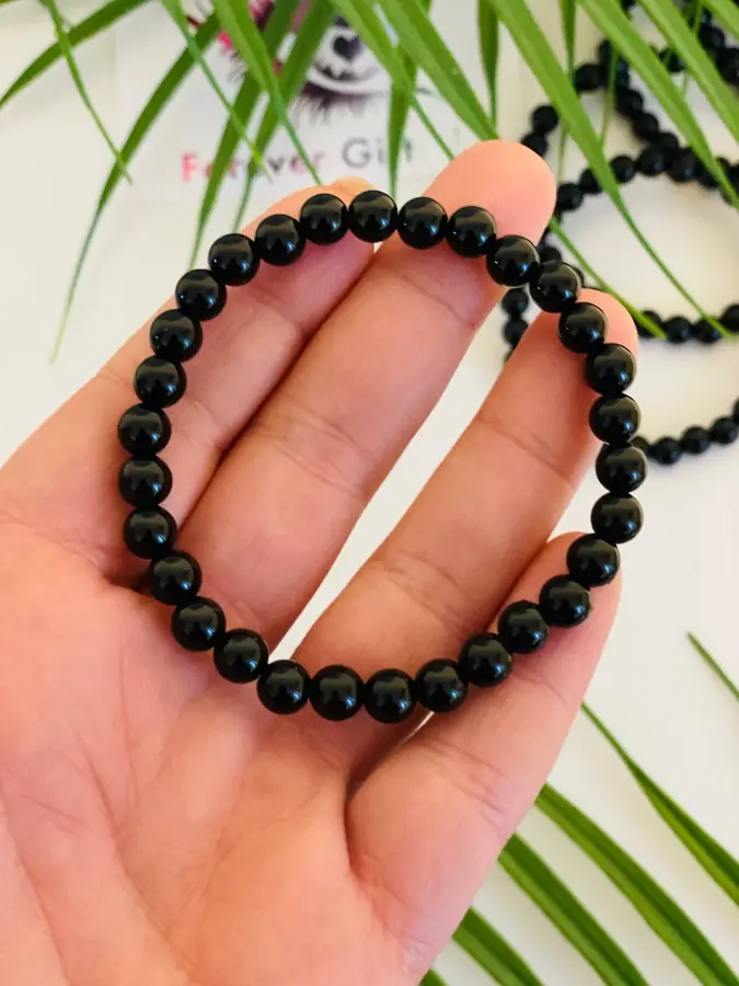 Obsidian bracelet, held in the hand
